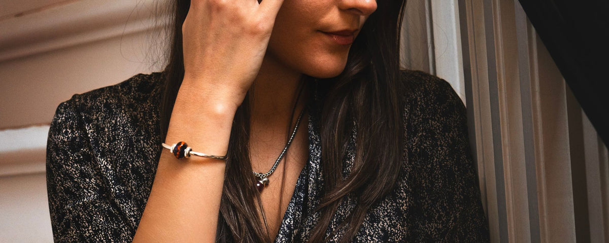 fire power bangle worn by a model